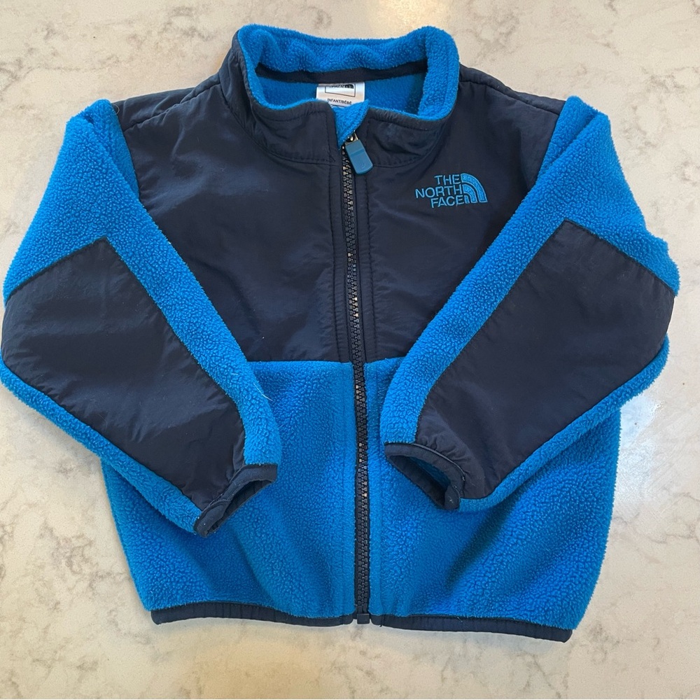 The North Face Infant Blue Fleece Jacket, Navy and Blue, Size 12-18 months.